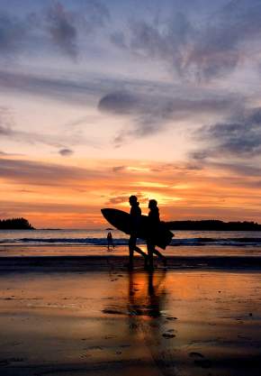 Paddleboarders at sunset